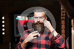 Bearded man with scissors