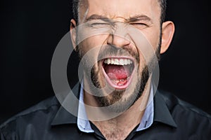 Bearded man screaming