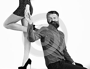 Bearded man with sexy female legs has smiling face