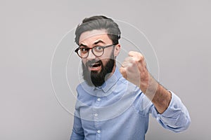 Bearded man showing fist