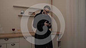 Bearded man with smartphone listening music