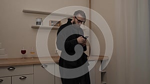 Bearded man with smartphone listening music