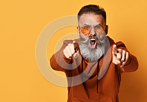 Bearded man in sportswear shouting expressing accusation