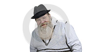 Bearded man talking to camera on white background.