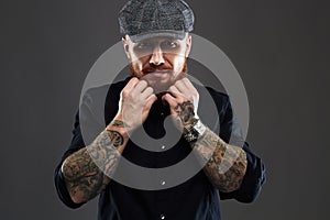 Bearded man with tattoo..brutal handsome man in hat