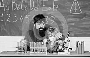 bearded man teacher with little boy. biotechnoloy research concept. Chemistry and physics biology. Back to school