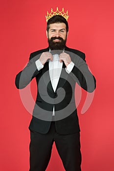 Bearded man in tuxedo and bow tie. Big boss. Formal event. King crown. Man groom in wedding suit. Egoist. Businessman in