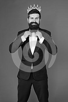 Bearded man in tuxedo and bow tie. Big boss. Formal event. King crown. Man groom in wedding suit. Egoist. Businessman in