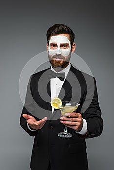 bearded man in tuxedo with clay