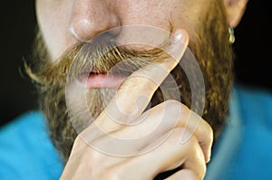 Bearded Man Twirling His Mustache