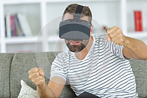 bearded man using virtual reality headset