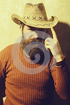 Bearded man wearing cowboy hat
