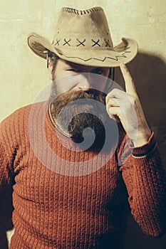 Bearded man wearing cowboy hat