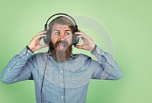 bearded man wearing headphones. listen to music. concept of online education. audio book. listen favorite song. new