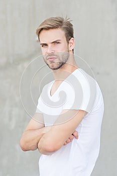 Bearded man white shirt. portrait of male attractiveness. young sexy guy gray background. confident macho man. summer