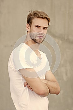 Bearded man white shirt. portrait of male attractiveness. young sexy guy gray background. confident macho man. summer