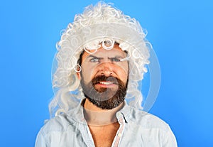 Bearded man in white wig. Barbershop concept. Handsome Male in periwig.