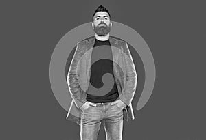 bearded mature guy wear casual on grey background. menswear photo