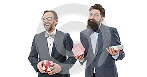 bearded men hold valentines present. businessmen partners in suit on party. success and reward. esthete. business