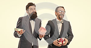bearded men hold valentines present. businessmen partners in suit on party. success and reward. esthete. business