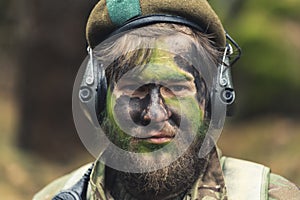 Bearded mid aged troop soldier posing with rage closeup