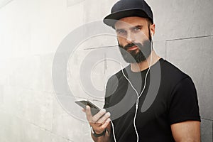 Bearded Muscular Man Wearing Black Tshirt Blank Snapback Cap Summer Time.Young Men Smiling Opposite Empty Gray Concrete