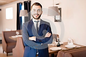 Bearded restaurateur in formal suit