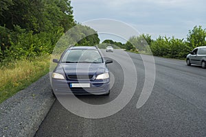 bearded senior sitting inside his car on dnipro-poltava highway while teveling