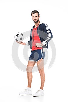 bearded soccer coach holding ball,