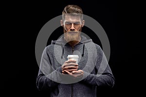 Bearded stylish man with cup of coffee