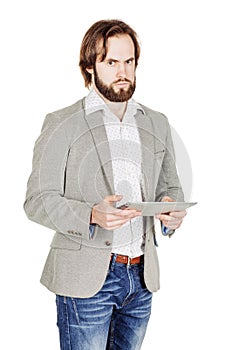 bearded young business man using digital tablet. portrait isolated over white studio background.