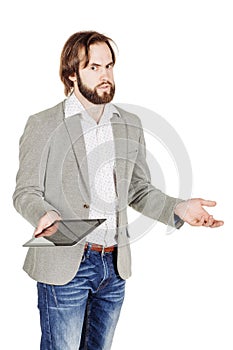 bearded young business man using digital tablet. portrait isolated over white studio background.