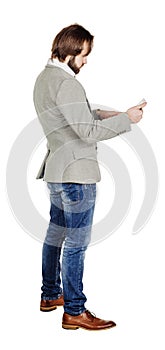 bearded young business man using digital tablet. portrait isolated over white studio background.