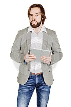 bearded young business man using digital tablet. portrait isolated over white studio background.