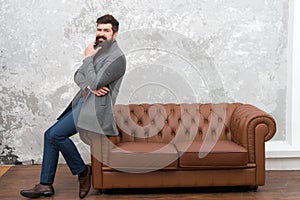 Beardoholic. Fashionable businessman or manager. Boss with fashionable beard and trendy hairstyle. Bearded man in