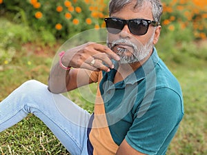 Beared Man wearing Sunglass in nature