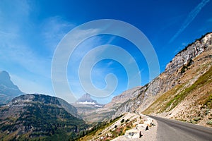 BEARHAT MOUNTAIN AT THE TOP OF LOGAN PASS ON THE GOING TO THE SUN HIGHWAY UNDER CIRRUS CLOUDS IN GLACIER NATIONAL PARK USA