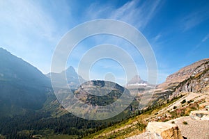 BEARHAT MOUNTAIN AT THE TOP OF LOGAN PASS ON THE GOING TO THE SUN HIGHWAY UNDER CIRRUS CLOUDS IN GLACIER NATIONAL PARK USA