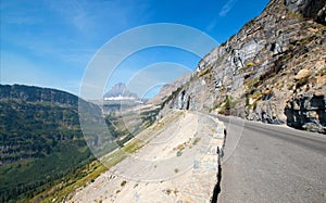 BEARHAT MOUNTAIN AT THE TOP OF LOGAN PASS ON THE GOING TO THE SUN HIGHWAY UNDER CIRRUS CLOUDS IN GLACIER NATIONAL PARK USA