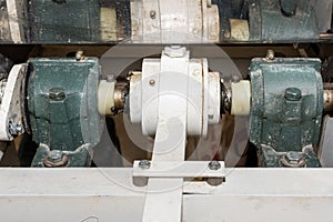 Bearings holding the shaft of a nixtamal mill