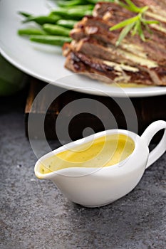 Bearnaise sauce in a sauce dish photo