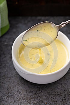 Bearnaise sauce in a small bowl photo