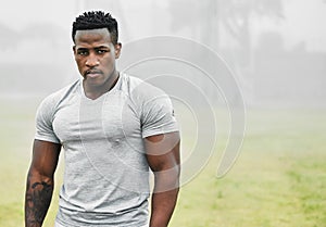 Beast mode, engaged. Cropped portrait of a handsome young male athlete exercising outside.