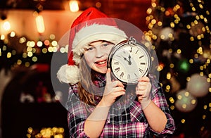 Beat the Christmas rush. Santa little girl. New year party. Xmas mood. Little girl in hat. Xmas holiday. Little girl
