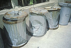 Beaten and dented New York trash cans