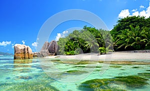 Beatiful beach Anse Source d`Argent with big granite rocks in sunny day. La Digue Island, Seychelles.