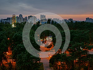 Beatiful colorful dusk over park and high rises in Kyiv city