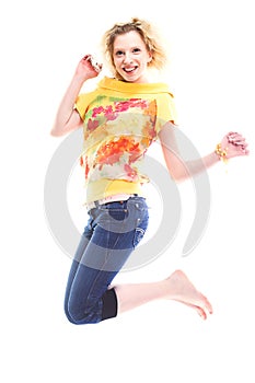 Beatiful girl jumping of joy over white