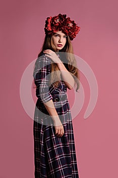 beatiful girl with a wreath in studio