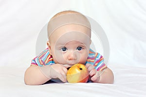 Beatiful little boy with apple